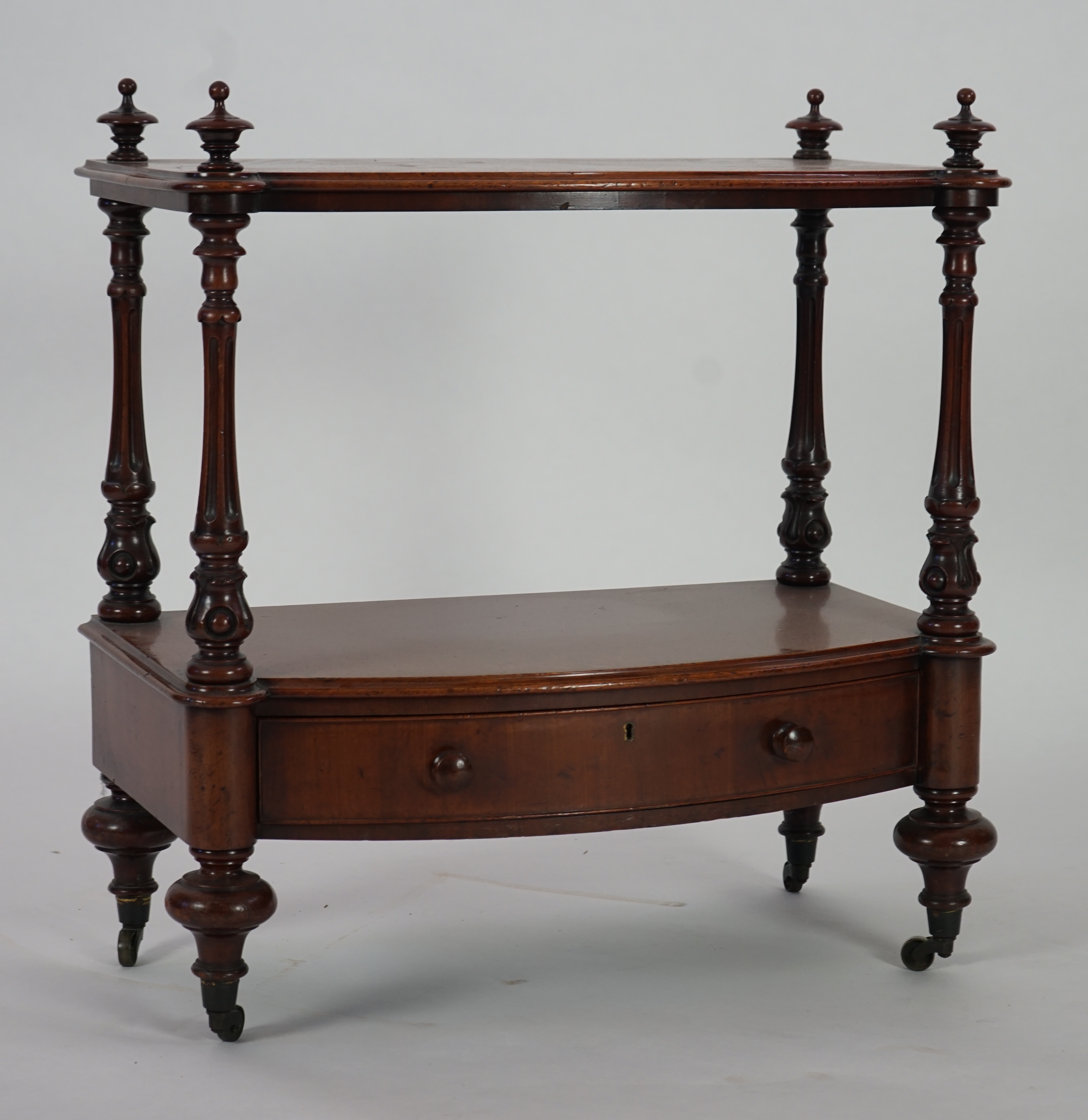 A Victorian mahogany bow fronted two tier whatnot, with fitted drawer, width 66cm, height 73cm. Condition - good